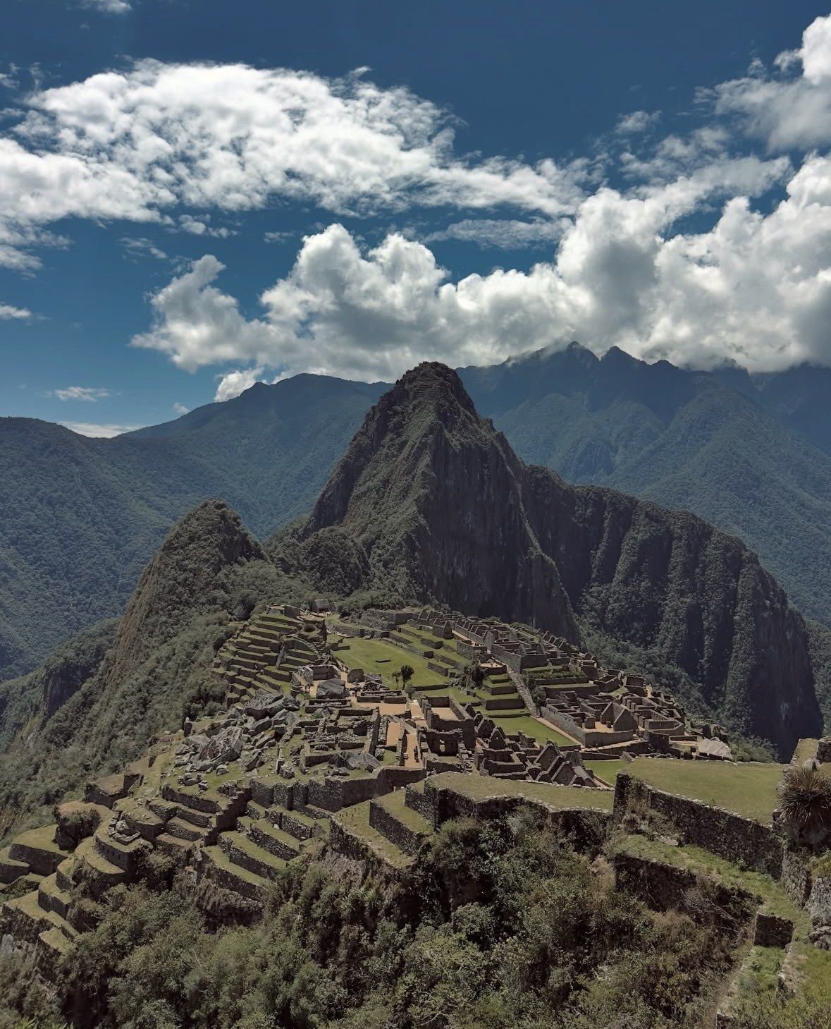White clouds and deep blue sky above the Machu Picchu citadel